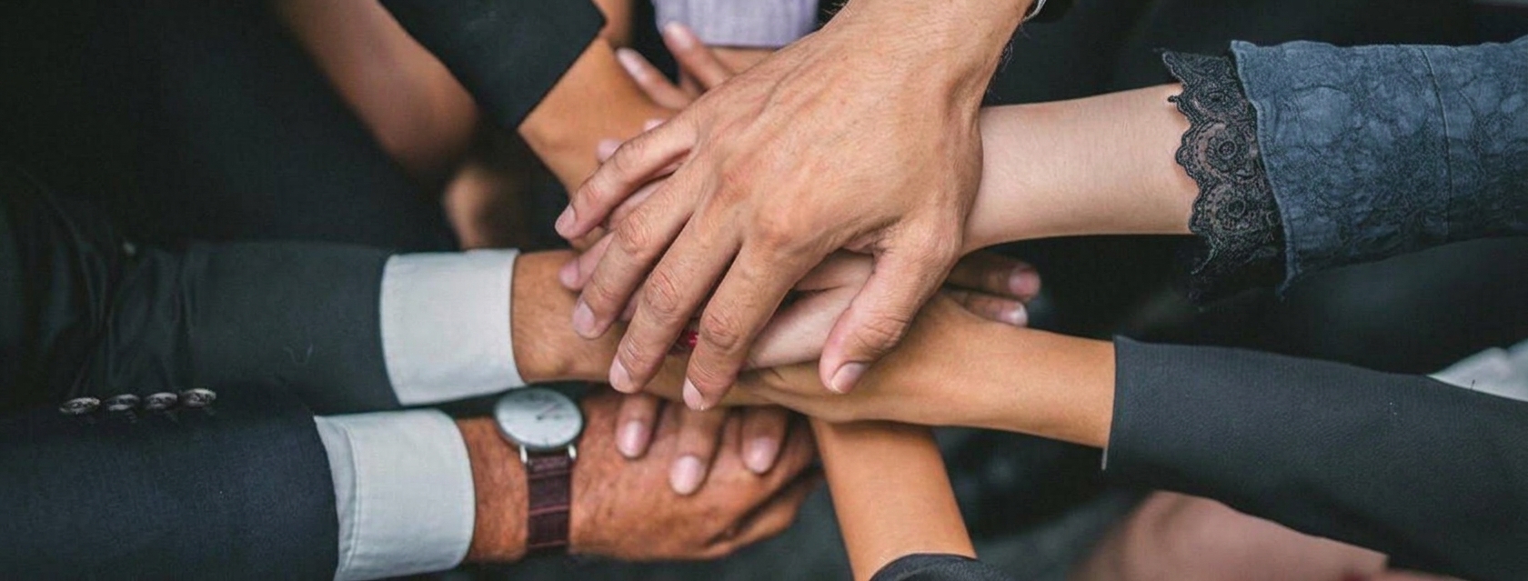 Team hands stacked together